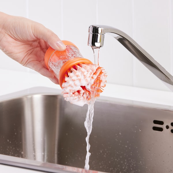 Dish-washing brush with dispenser, bright orange