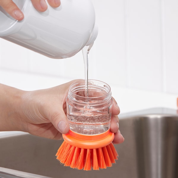 Dish-washing brush with dispenser, bright orange